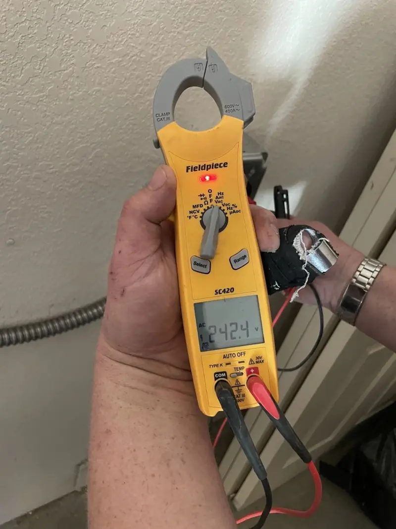 Voltage testing with clamp meter during Ceiling Fan Installation in Alexandria